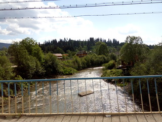 View from the bridge to the river in the Carpathians