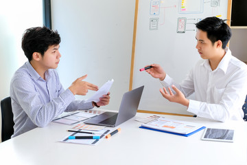Young man designers planning work together on website ux app development.