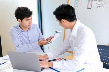 Young man designers planning work together on website ux app development.