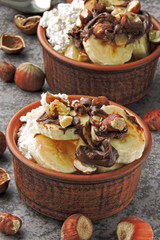 Keto breakfast or dessert. Cottage cheese with banana, hazelnuts and chocolate paste. Keto diet.