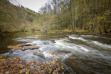 Naklejka premium The river Ourthe in autumn and dark conditions peaceful photo