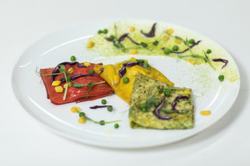 Pancakes of different color on a plate. We prepare with children