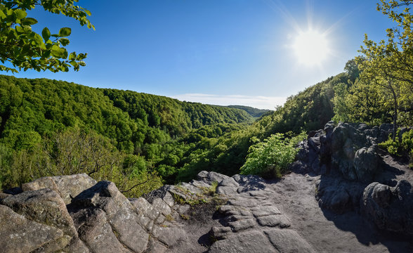 Great panoramic view over the green forest valley of Soderasen National Park under the blue sky Sweden