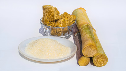 pieces of sugarcane with white sugar