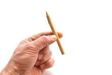 Wooden stake in hand on a white background.