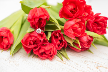 bouquet of tulips and engagement ring