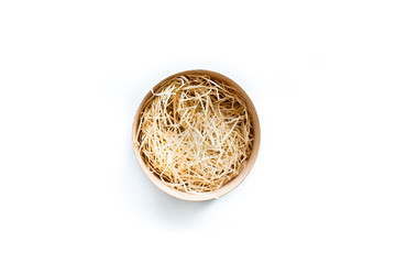 Top view of open round wooden gift box with decorative hay inside