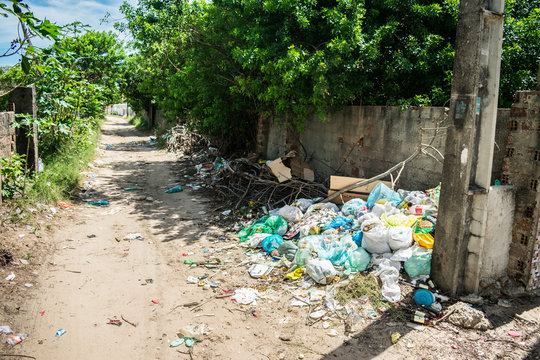 Ilha de Itamaraca, Brazil - Circa March 2019: Pile of litter at a street corner - Itamaraca has a very serious problem with rubbish disposal and trash management