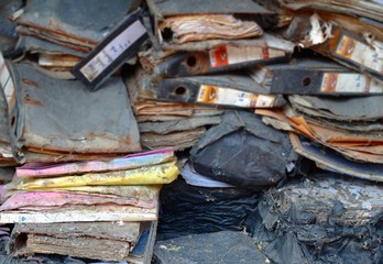 Stack of old documents, broken down in black bags, damaged old documents Garbage from office documents Paper stack background
