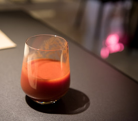 Glass of tomato juice on the table
