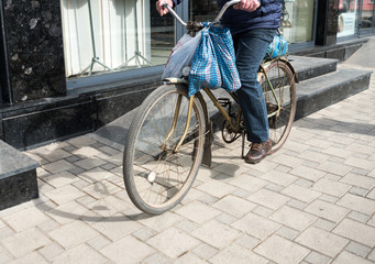 Senior man riding his old  bike