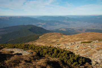 Fototapeta na wymiar Panoramic view of idyllic mountain scenery in sunny day