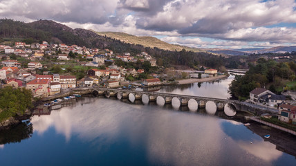 Fototapeta na wymiar Aerial view of roman bridge in Pontesampaio, Pontevedra, Galicia, Spain. Way of St. James.