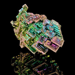Amazing colorful rainbow Bismuth Gemstone macro closeup isolated on black background