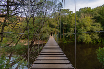 Fototapeta na wymiar Suspension bridge, Crossing the river in Soutomaior, Pontevedra, Galicia, Spain.