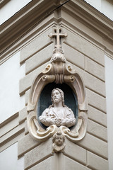 Fototapeta na wymiar Jesus Christ, statue on the house facade in Florence, Italy
