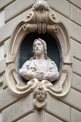 Jesus Christ, statue on the house facade  in Florence, Italy