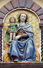 Madonna and Child by Giovanni Della Robbia on the portal of San Barnaba Church in Florence, Italy