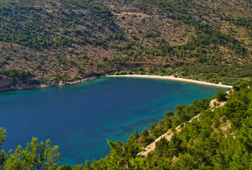 Fototapeta premium Elinda beach in central west Chios island, Greece. Beautiful isolated beach with turquoise water, view from above.