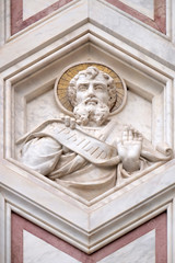 Fototapeta na wymiar Saint Philip, relief on the facade of Basilica of Santa Croce (Basilica of the Holy Cross) - famous Franciscan church in Florence, Italy