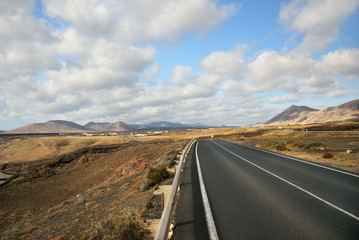 Tar road between volcanic landscape. Lanzarote. Spain
