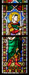 Saint Michael the Archangel, stained glass window in the Basilica di Santa Croce (Basilica of the Holy Cross) - famous Franciscan church in Florence, Italy