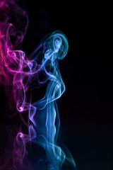 Obraz premium Abstract backgrounds and wallpapers. Colorful smoke on black background..