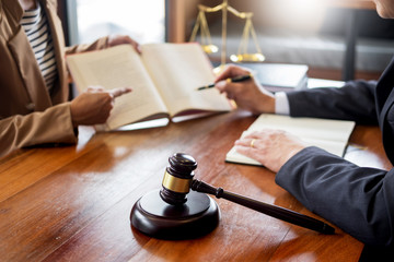 lawyer in office. Counseling and giving advice about legal legislation in courtroom to help...