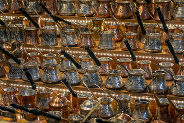 Many copper pots for coffee