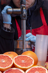 Juice Extractor squeezes the juice from the grapefruit