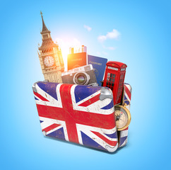 Trip to London, Great Britain.Vintage suiitcase with symbols of UK London, Big Ben tower and red booth. Travel and tourism concept.