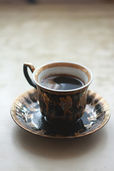 A cup of hot coffee on the table