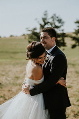 bride and groom smiling