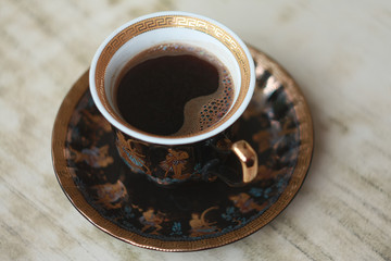 A cup of hot coffee on the table