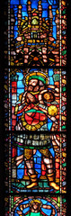 Fototapeta na wymiar Catholic Saint, stained glass window in the Basilica di Santa Croce (Basilica of the Holy Cross) - famous Franciscan church in Florence, Italy