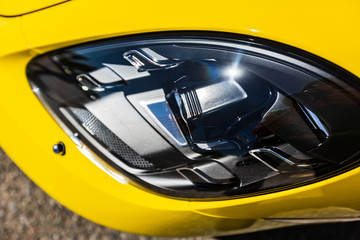 Automotive black diode headlamp with yellow body top view plastic