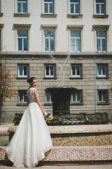 bride in white dress with bouquet