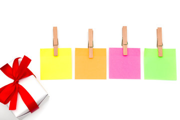 Wooden clips,Clothespin Sticky notes and White gift box isolate on white background concepts