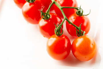 Top view of white surface with ripe tomatoes on it