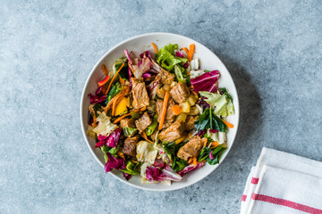 Fresh Salad with Cubed Meat Pieces in Bowl.