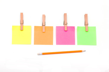 Wooden clips,Clothespin Sticky notes and a pencil isolate on white background concepts