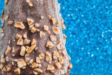 ice cream with chocolate coating and pieces of peanuts