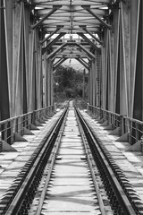 Fototapeta na wymiar industrial landscape with railway bridge, black and white photo