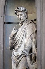 Fototapeta na wymiar Dante Alighieri in the Niches of the Uffizi Colonnade. The first half of the 19th Century they were occupied by 28 statues of famous people in Florence, Italy
