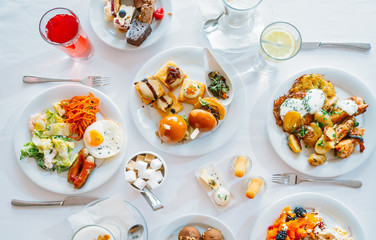 Breakfast Buffet Concept, Breakfast Time in Luxury Hotel, Brunch with Family in Restaurant, Top View of the Table with Plates of Food for Breakfast - Image