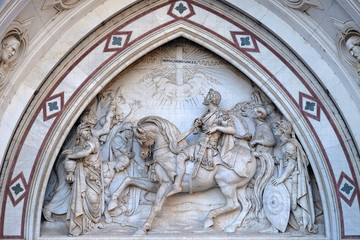 Obraz premium Sculpted lunette containing a scene depicting the Vision of Constantine, by Emilio Zocchi, over the right door of Basilica of Santa Croce in Florence, Italy