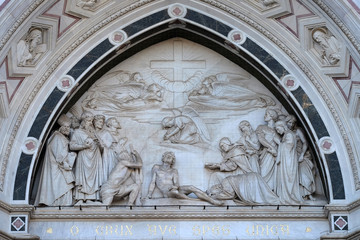 Sculpted lunette containing a relief of the Triumph of the Cross, by Giovanni Dupre, over the central door of the of Basilica of Santa Croce in Florence, Italy
