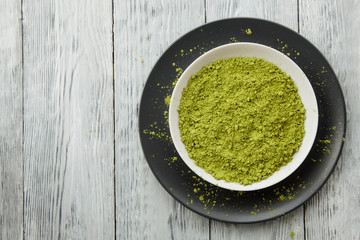 Top view of bowl with green tea powder or matcha used as Asian or Japanese