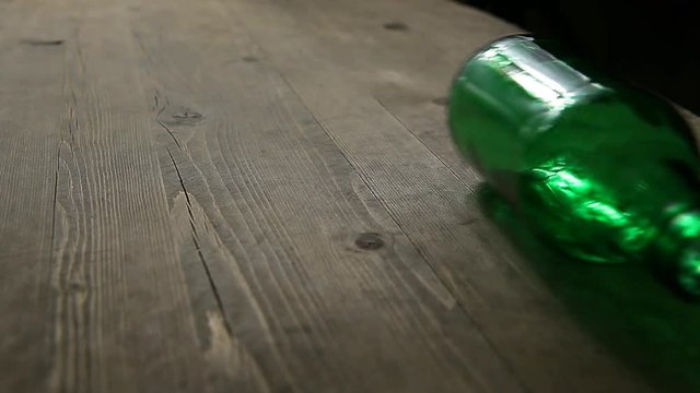 empty bottle rotate wooden table hd footage nobody 