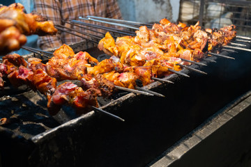 Chicken seekh kababs are being prepared road side